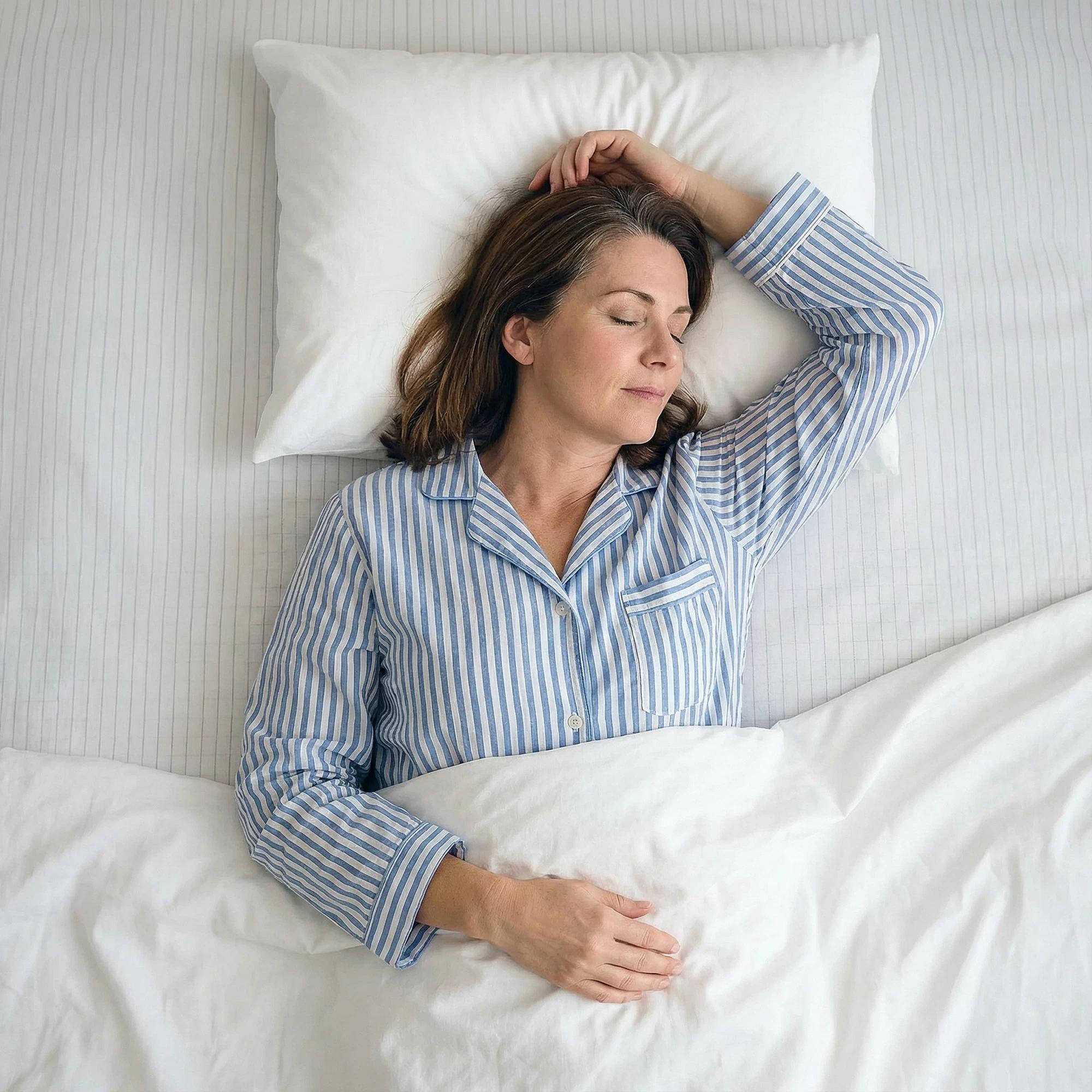Woman sleeping in striped pajamas